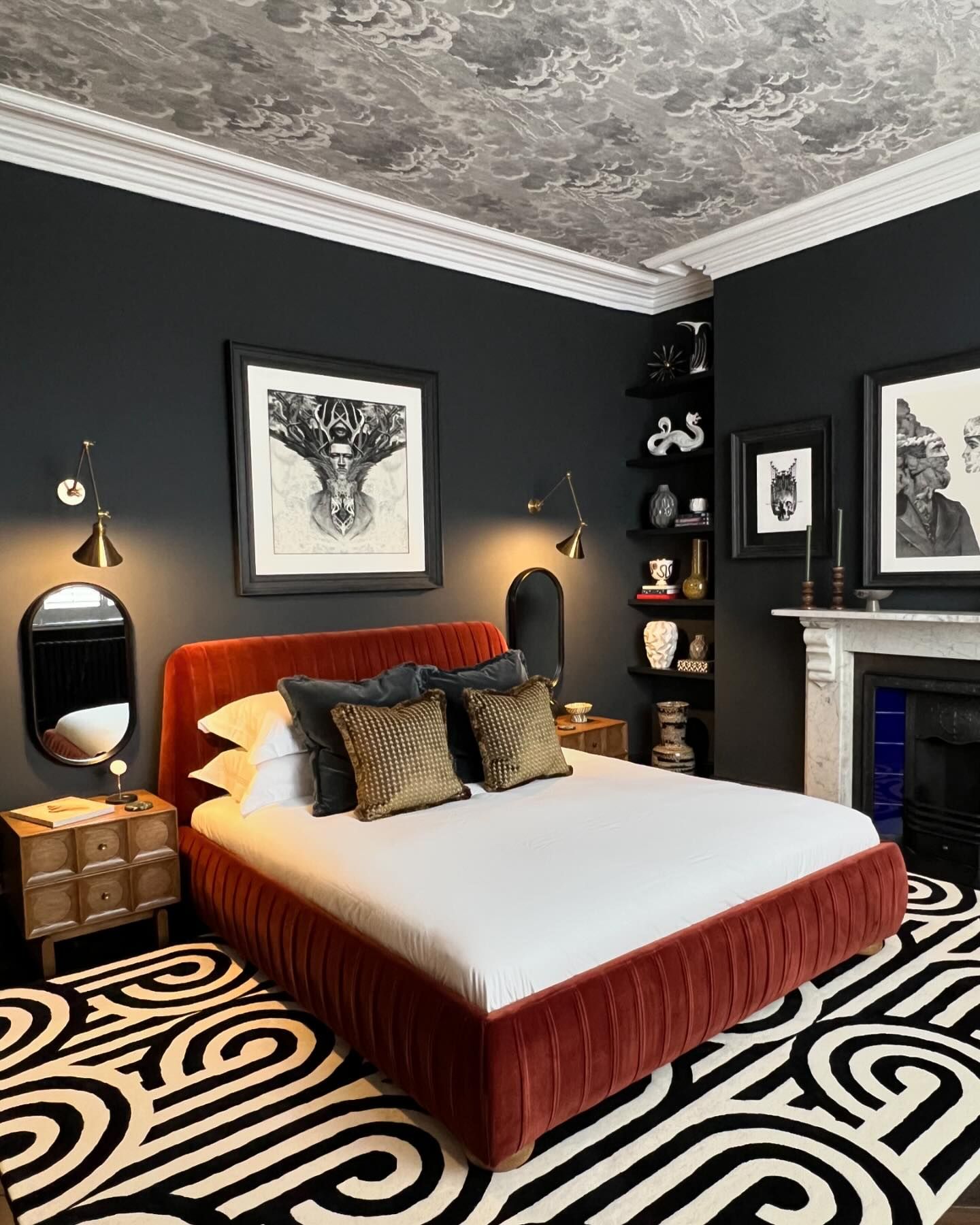 Dramatic black bedroom with wallpapered ceiling in a Victorian home with Farrow and Ball Railings