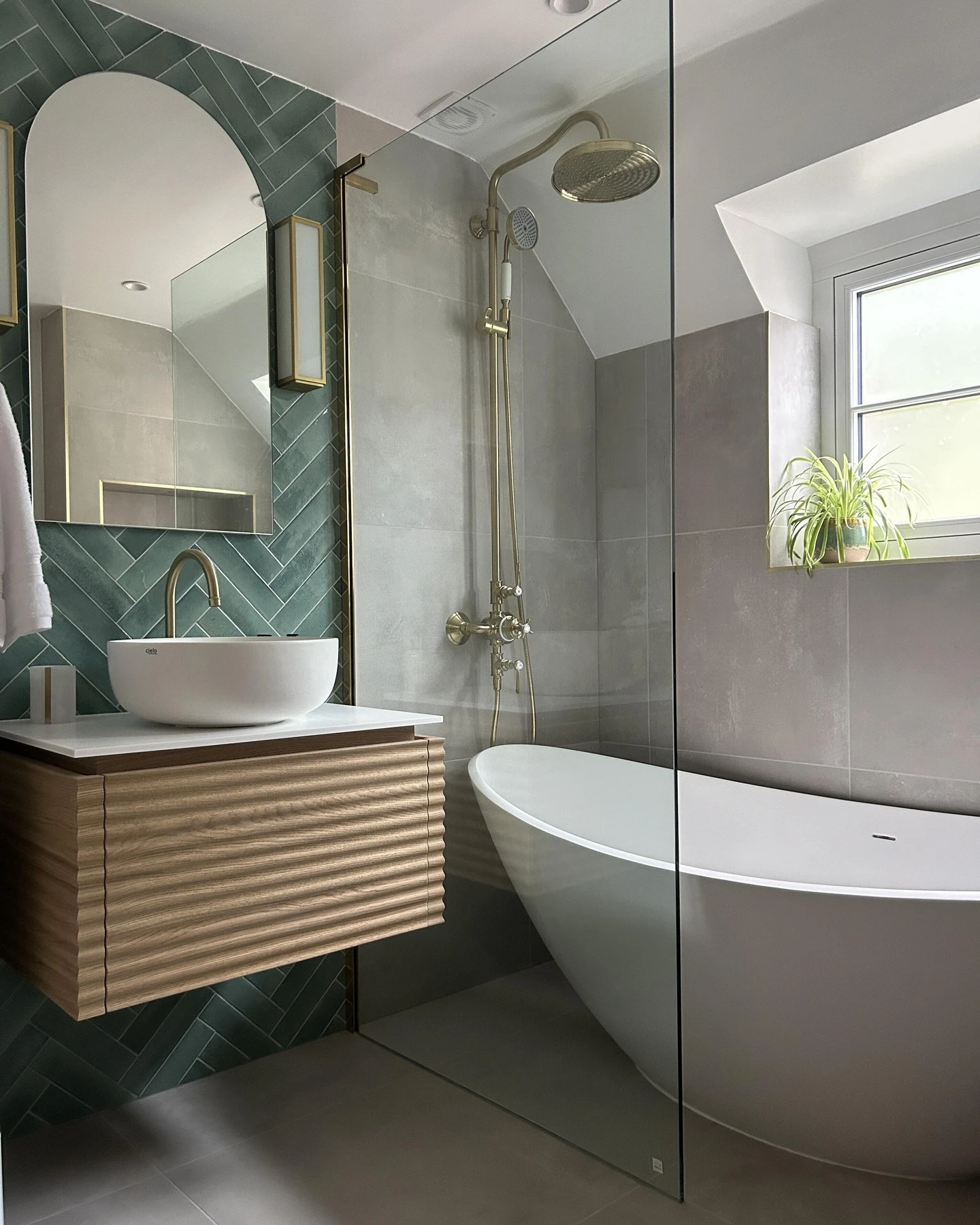 A small bathroom with a clever layout and frameless shower screen
