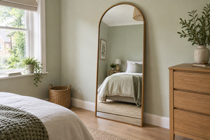 A full-length mirror can brighten a bedroom and make it feel larger, but glass safety, anchoring, proportions and placement matter more than frame colour alone.