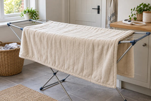 A practical care routine for washing, drying and putting away an electric throw.